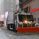 Snowplows drive through Times Square during a winter storm on Feb. 1, 2021.